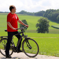 Rinderspacher auf dem Fahrrad